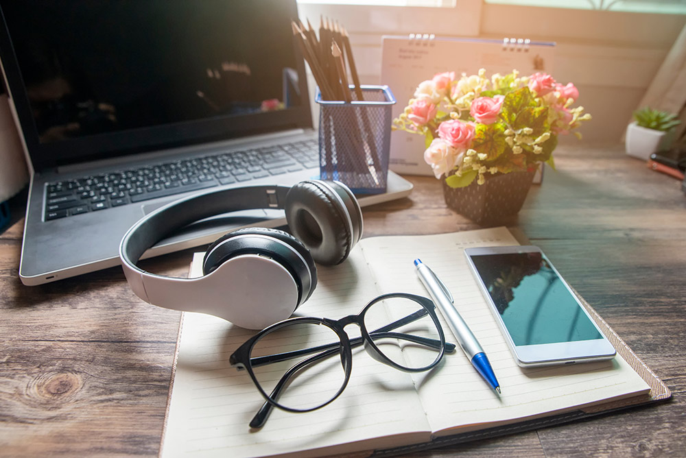 Put on earphones or headphones to keep your work area quiet or listen to cafe noises to simulate an office environment - Tips on Being Productive At Home - Carousell Philippines Blog